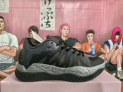 Side profile of a black and gray PUMA sneaker