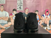 Rear view of black high-top sneakers showing black heel branding, padded collars and glossy black midsoles.