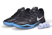 Pair of black Nike Sabrina 4 basketball shoes with blue outsole accents