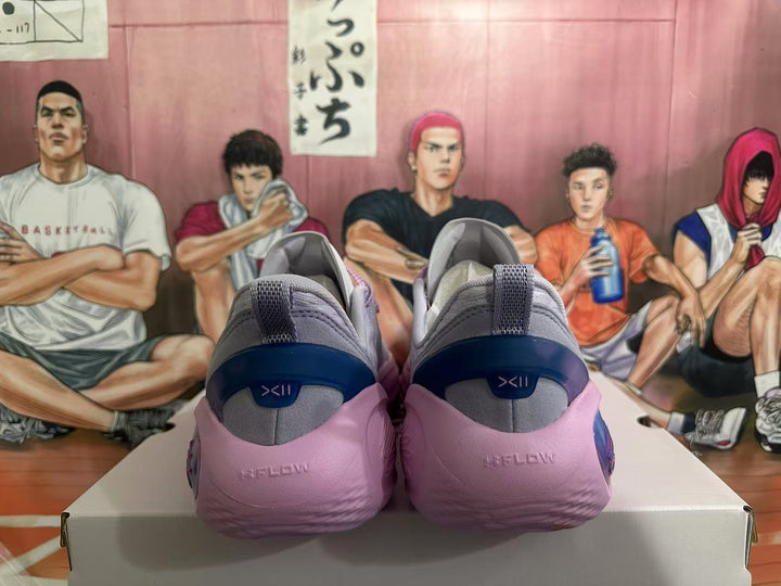 Rear view of gray and pink Kyrie basketball shoes showing heel details.