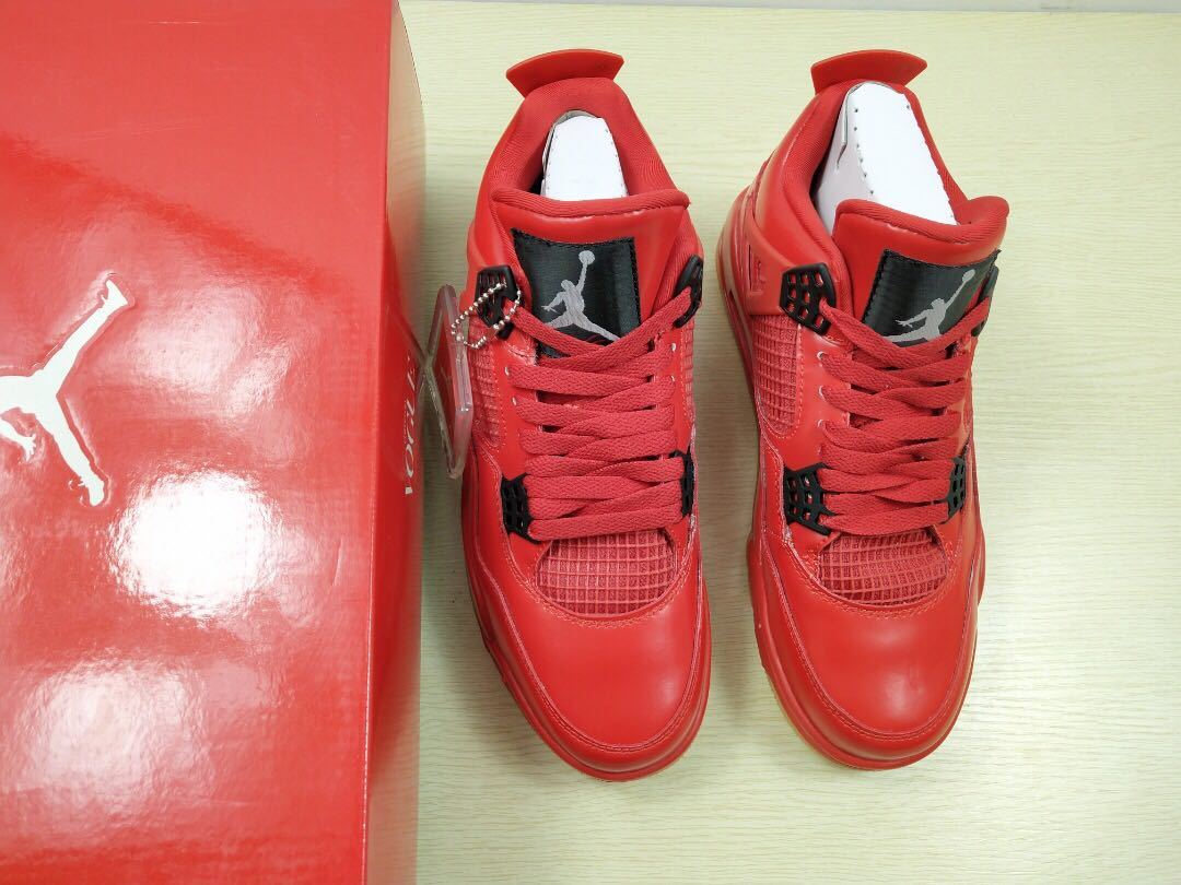 Pair of red high-top sneakers shown from above beside a red Jordan-style box.