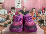 Front view showing the purple laces, layered toe panels, and darker toe accents.