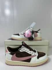 Close side view showing the reversed pink Swoosh, perforated eyestay, and brown collar.
