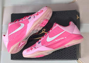 Pink Kobe 5 pair shown at an angle with the outsole visible