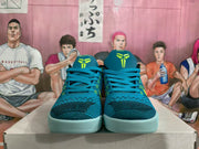 Front view of the blue basketball sneakers showing the patterned uppers, laces, and volt tongue details.