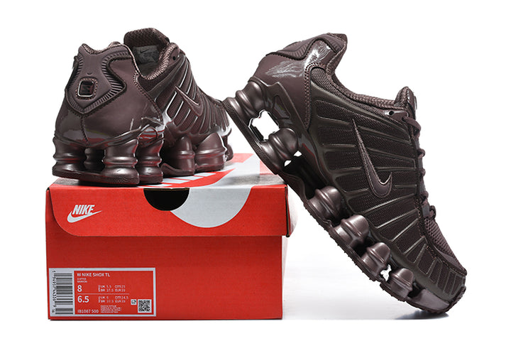 Dark brown Nike Shox TL sneakers displayed on a Nike shoe box; the box label shows size 8.