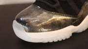 Close-up of the dark metallic-look toe and white outsole edge.