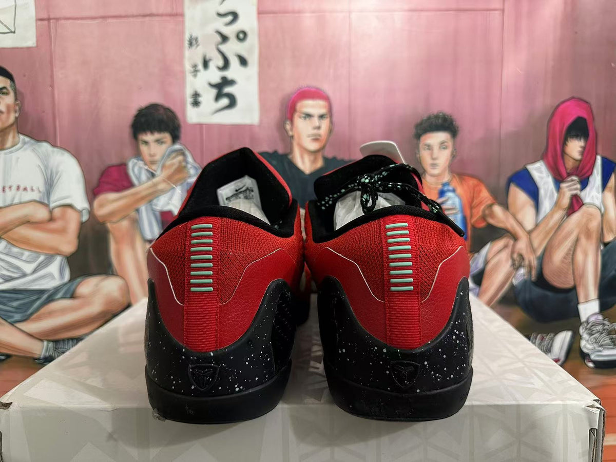 Rear view of red and black low-top basketball shoes with speckled black heels.