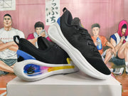 Angled view of the black basketball shoes showing their laces, heel accents and gradient side detail.