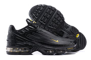 Side and outsole views of black Nike Air Max Plus III sneakers.