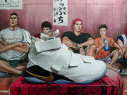 Side view of a white Nike LeBron basketball shoe with black heel panel, gold Swoosh, and translucent outsole.