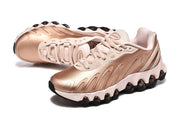 Angled view of the rose-gold Nike Air Max DN 8 pair.