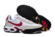 Pair of white and red Nike-branded sneakers, including a view of the black lugged outsoles.