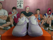Front view showing the white and light purple Nike sneakers with white laces and padded collars.