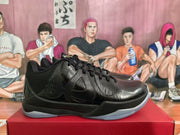 Side profile showing layered black side panels, glossy accents, and a translucent outsole.