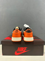 Rear view showing orange heel panels and Jordan branding on the heel tabs.