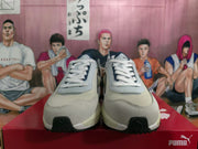 Front view of white and navy PUMA Rider Elite sneakers with lace-up closure