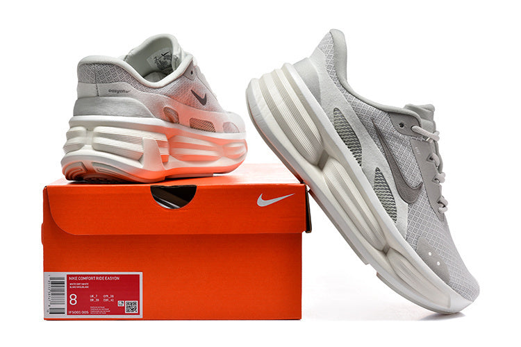 Light grey Nike Comfort Ride Easy-On sneakers shown with the shoe box; its label displays size 8.