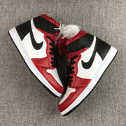 Overhead angled view of the pair highlighting the red, white, and black color blocking and additional laces.
