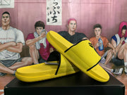 Angled view showing the yellow textured upper, black edging, molded footbed, and outsole.