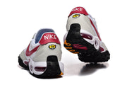 Rear and outsole views of white and red Nike-branded sneakers.