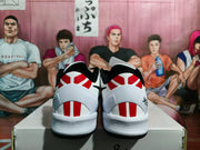 Rear view showing the white heel, red vertical accents, black collar, and black outsole.