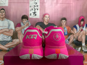 Rear view showing the contrasting heel emblems and patterned outsole sections.