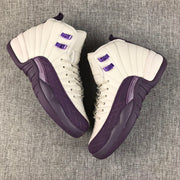 Pair of off-white and purple Air Jordan 12 sneakers viewed from above