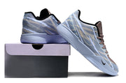 Blue-gray camouflage Nike Ja 2 shoes displayed beside a shoe box