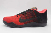 Side view of a red and black Nike Kobe 11 basketball shoe with black Swoosh and laces.