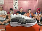 Side view of a white, grey, and black sneaker with a side Swoosh