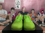 Front view showing the matching green laces, textured toe boxes, and rounded green outsoles.