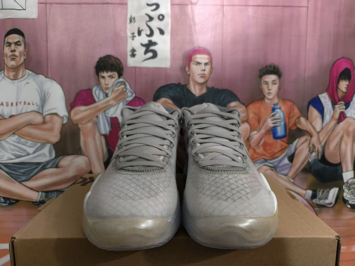 Front view of wolf grey Nike Kevin Durant basketball sneakers resting on a shoebox.