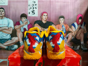 Rear view showing the multicolor heel panels and yellow textured outsoles.