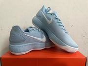 Pair of light blue Nike basketball shoes shown from the side.