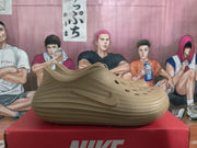Side profile of a khaki Nike sneaker showing the molded Swoosh detail and sculpted sole.