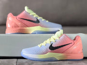 Side view of the basketball sneaker with pink heel, pale blue forefoot and pale yellow midsole accent.