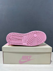 Underside view showing the pink rubber outsole and circular tread design.