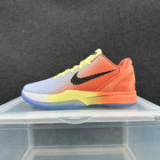Side profile of a Nike Zoom basketball sneaker with a lavender-to-orange gradient upper, yellow laces, black side branding, and a translucent blue outsole.