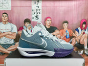 Side profile of the gray and purple Nike basketball sneaker with a white midsole and textured forefoot panel.