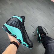 Bottom and side view highlighting the green outsole edge and black traction sections