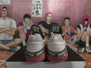 Rear view showing the padded collars, textured heel panels, and layered soles of the Nike sneakers.