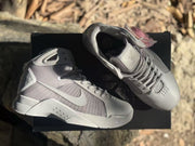 Top view of the sneakers showing the padded interior, tongues, laces, and gray panel detailing.