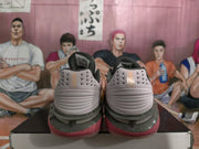 Rear view showing the padded heels, ventilated heel panels, and layered sole design of the pink and white Nike shoes.