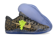 Black and gold Kobe 11 shoe beside its translucent blue outsole