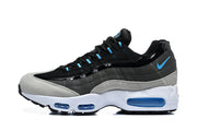Side view of a black and grey Nike Air Max 95 TT sneaker with blue accents and a white sole.