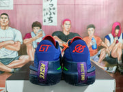 Rear view showing the heel panels, GT branding, purple details, and dark rubber outsole.