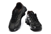 Top-front view of a pair of black Nike Shox Ride 2 sneakers with lace-up closures.