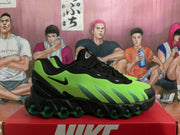 Side profile of a black and bright green Nike Air Max sneaker showing the swoosh, textured green upper, and visible air units.