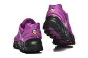 Rear view of purple Nike Air Max DN 8 sneakers and their black soles.